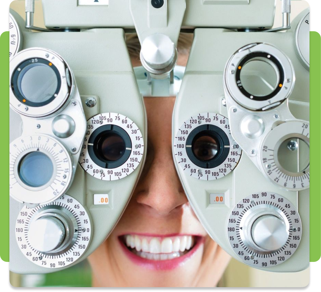 A woman is looking through the lens of an eye test.